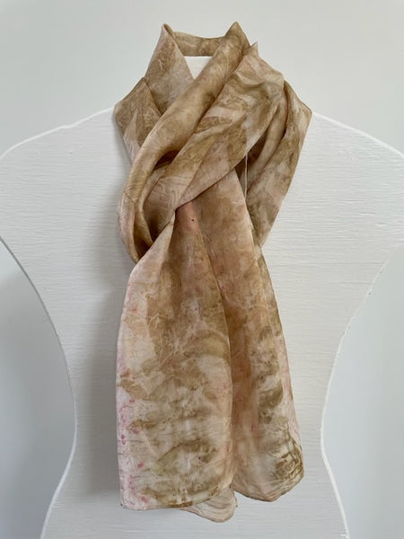 pale pink silk scarf with natural pecan leaf eco print pattern in soft brown color on  white body form neck