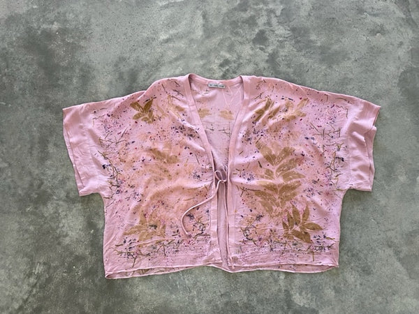 vibrant pink silk kimono jacket with eco print on concrete ground