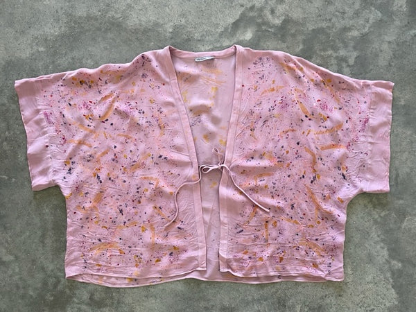 vibrant pink silk kimono jacket with eco print on concrete ground