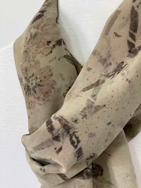 detail of silk scarf medium taupe color with natural dye flower print on white body form